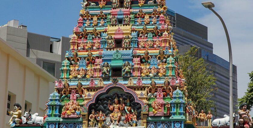 Front view of Avinashi Lingeshwarar Temple showing temple complex and a few people outside