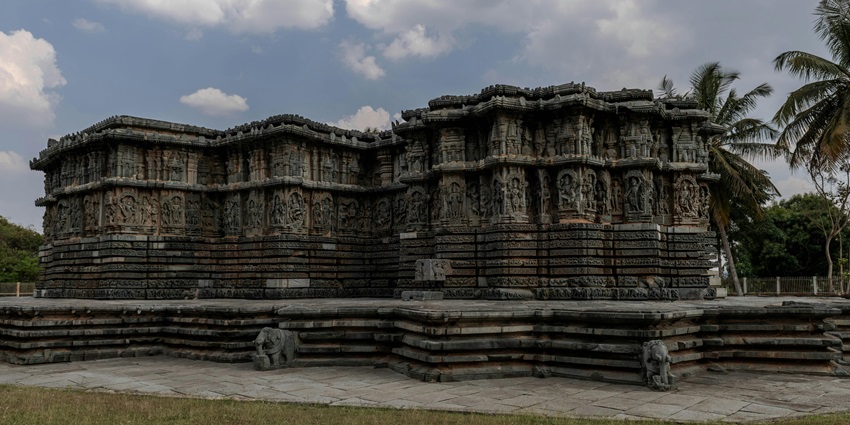 An image of the ancient stone temple with detailed carvings and historic sculptures in Coimbatore.