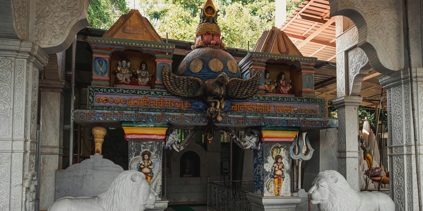 An ornate entrance of Ayyappan temples in Coimbatore with detailed carvings.