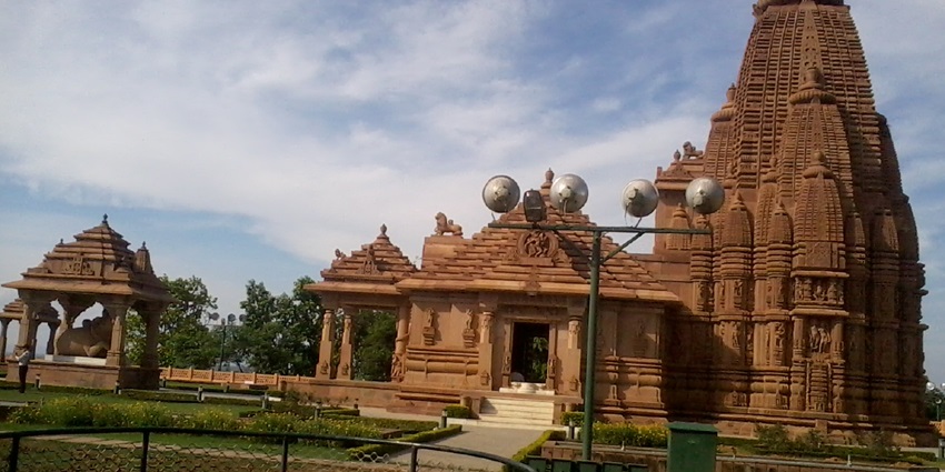 Stone-built Shiva temple with carved pillars and traditional South Indian architecture.