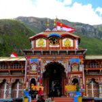 Badrinath Temple entrance is adorned with colourful designs and iconic Hindu symbols.