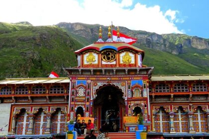 Badrinath Temple entrance is adorned with colourful designs and iconic Hindu symbols.