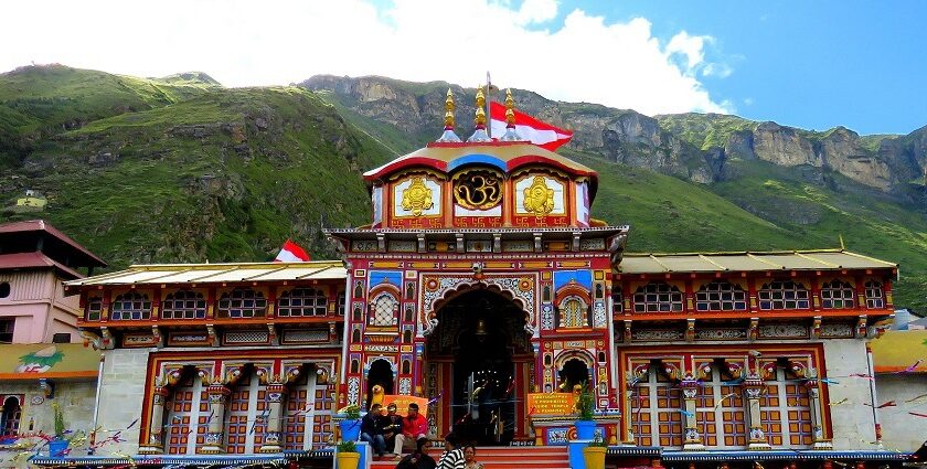 Badrinath Temple entrance is adorned with colourful designs and iconic Hindu symbols.