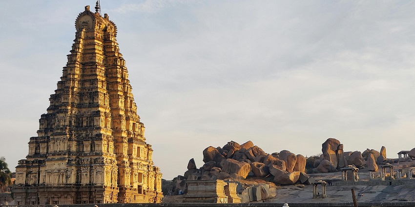 Hilltop Balamurugan Temple in Ratnagiri with golden gopuram, panoramic views, and serene Murugan sanctum for devotees.
