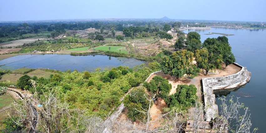 View of Barua Sagar Lake from the hilltop fort with trees and water below–places to visit near jhansi