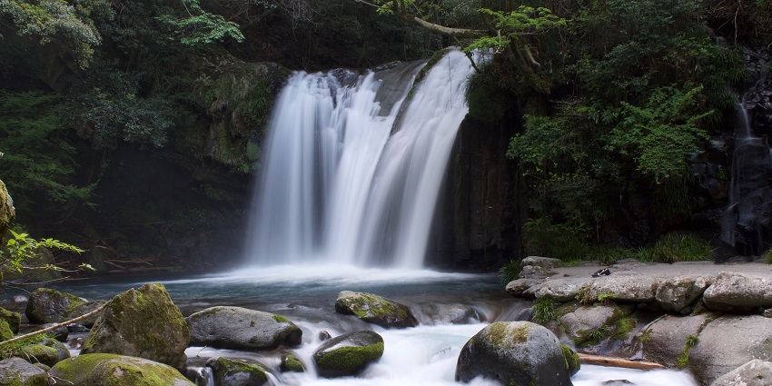 An image showing stunning waterfall flowing through rocks resembling Siruvani Waterfalls