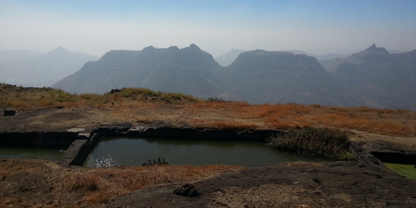 An image showing the dense green scenery of Mulher Fort during the monsoon season.