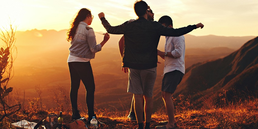 An image of people at the top mountain, a rewarding moment on the Harihar Fort trekking trail.