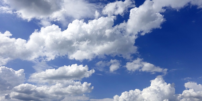 Dramatic clouds in the blue sky, creating a calm and peaceful heavenly atmosphere.