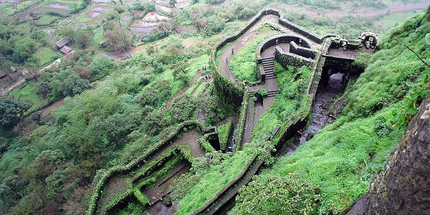 A soothing view of lush greenery surrounding the Ghangad Fort
