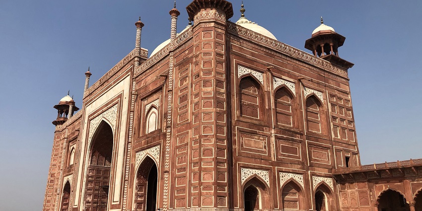 Picturesque view of mosque at Taj Mahal, Agra during day time and people around