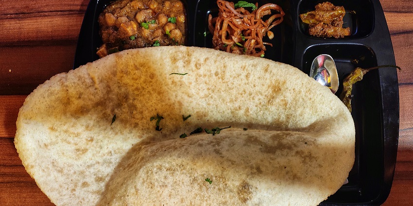Savor flavorful chole bhature that tantalizes your taste buds on your trip to Haridwar.