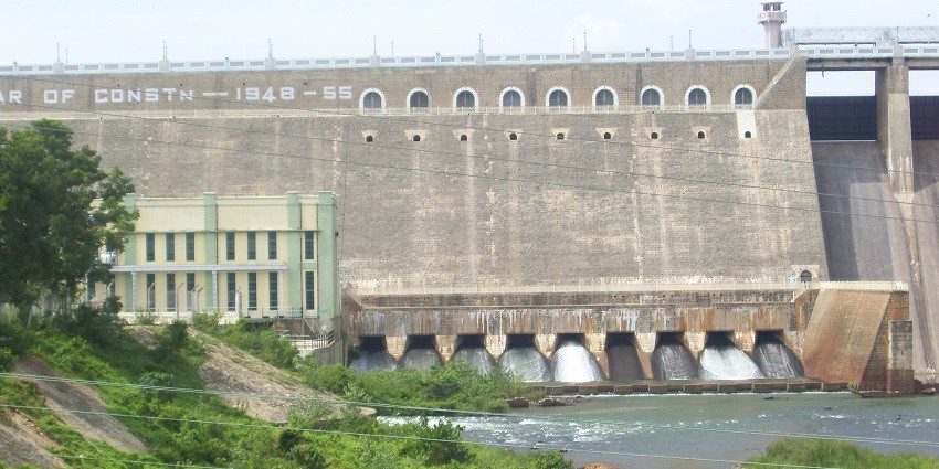 Bhavani Sagar Dam and its bridge structure and river surrounded by a green landscape.