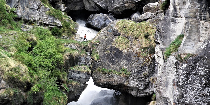 The rock bridge constructed upon Saraswati River located near Vasundhara Waterfalls