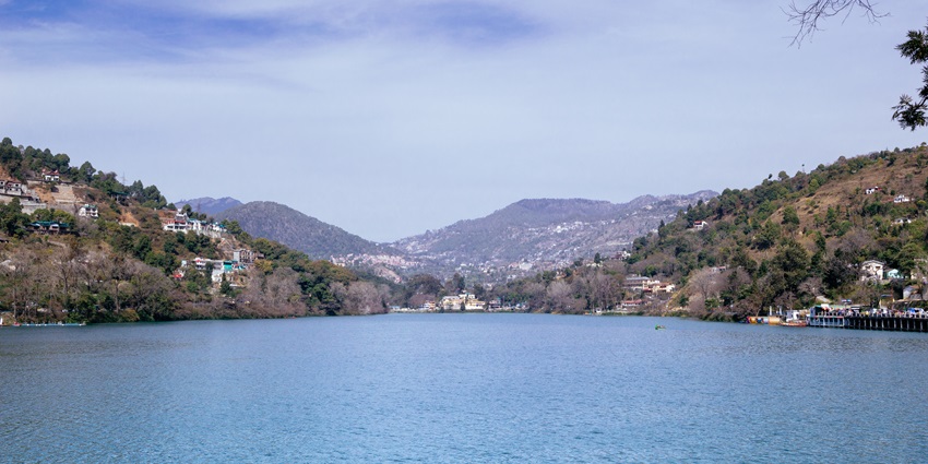 A picture of the majestic Bhimtal Lake with views of hill stations on all sides