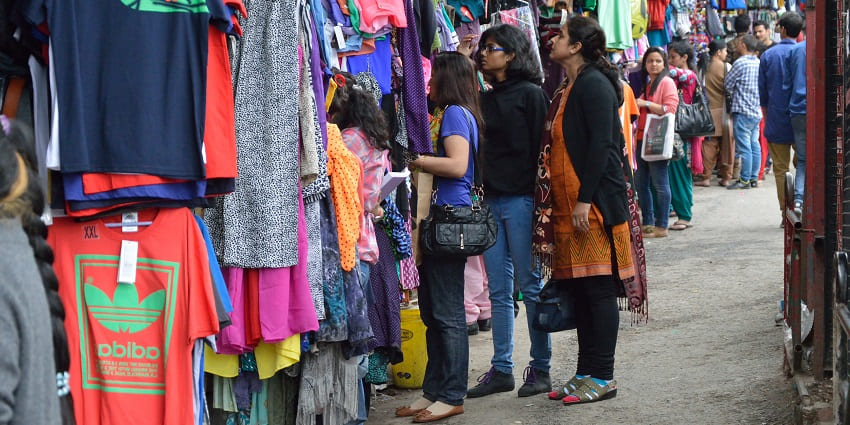 A girl buying winter wear and other clothes from Bhotia market in Uttarakhand