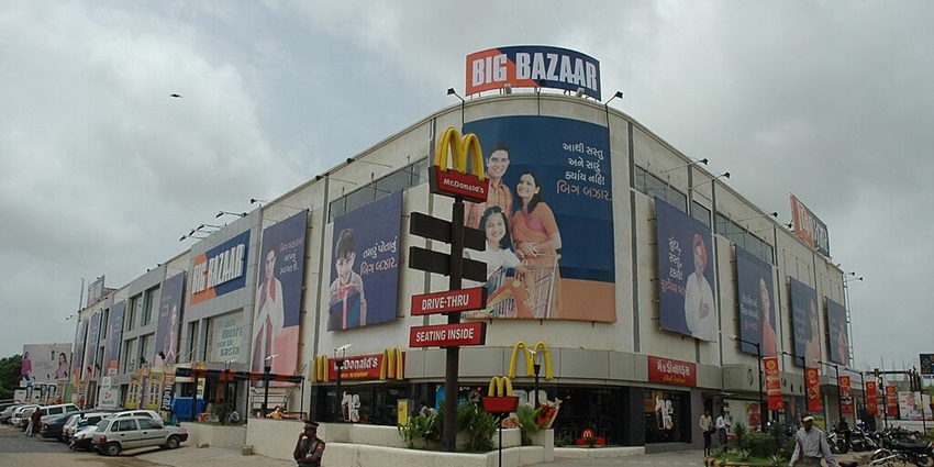 Major shopping street featuring various retail outlets and stores.