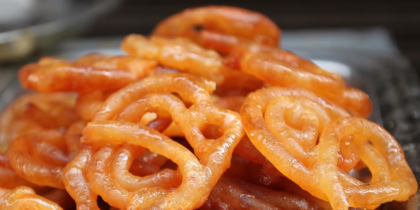 Traditional Indian sweets and snacks, highlighting the best food in Noida.