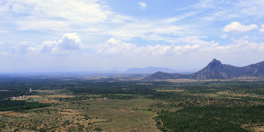 An image of Bodi, a tourist attraction near Megamalai Wildlife Sanctuary, featuring hills and greenery