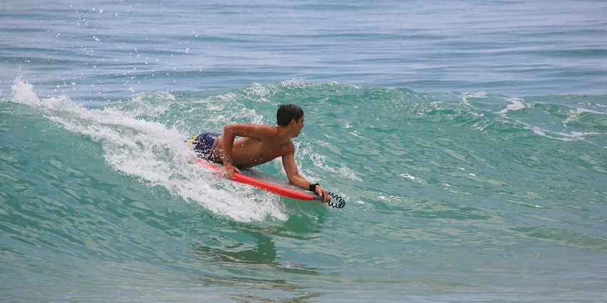 A picture of bodyboarding at Nagaon Beach, which is very popular there.