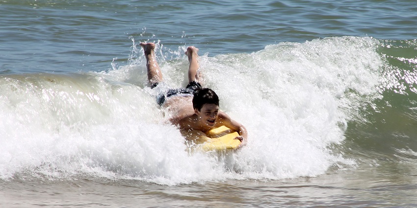 A picture of bodyboarding, which is one of the best Dandi Beach water sports.