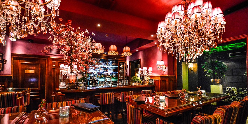 A bollywood themed bar celebrating Bollywood culture with music and decor.