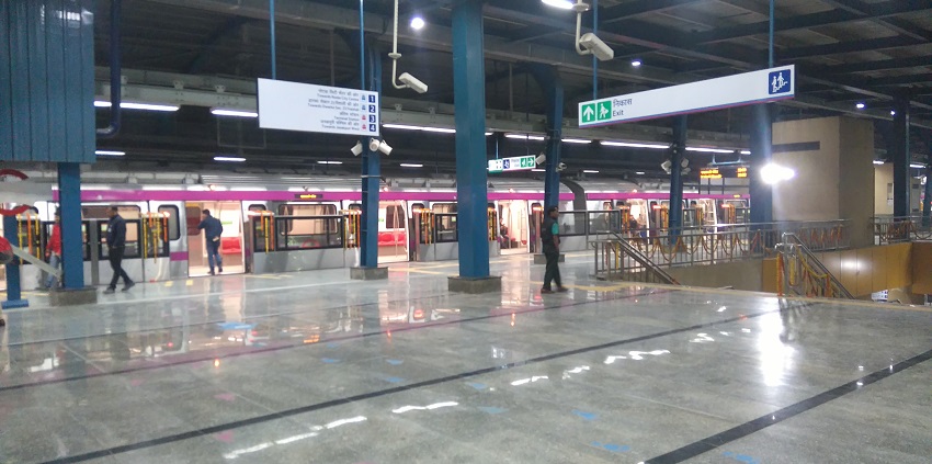 Metro in Botanical Garden station of the Magenta line network of Delhi Metro