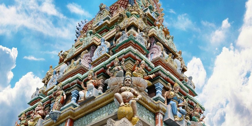 An image of a templar tower sculpted with complex colours and numerous statues.