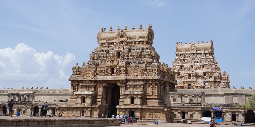 Brihadeeswarar Temple and its towering vimana with intricate carvings and open space.