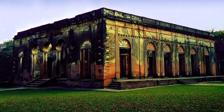 An exterior view of the Residency showcasing its beautiful architecture, with large windows.
