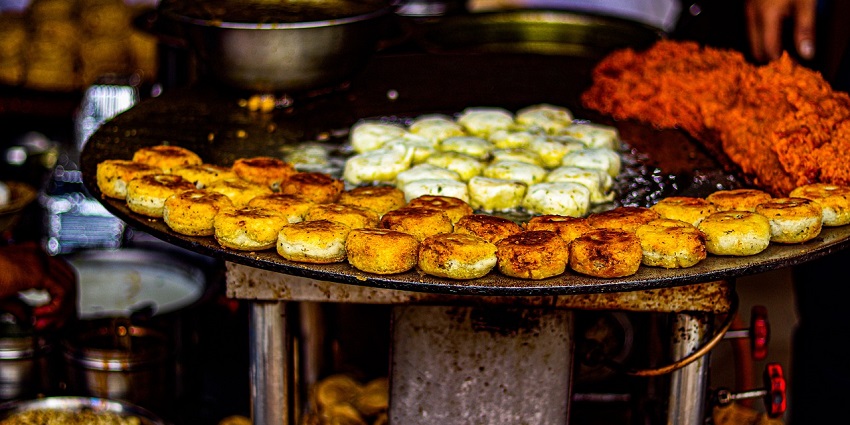 The best food in Dehradun is the flavorful potato patty sandwiched in a soft bun.