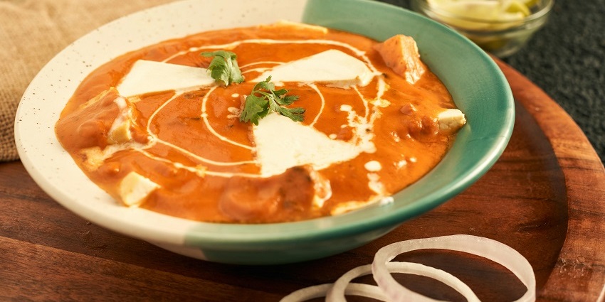 A bowl of Butter chicken served at Pind Baluchi, one of the best food in Ghaziabad for non veg lovers