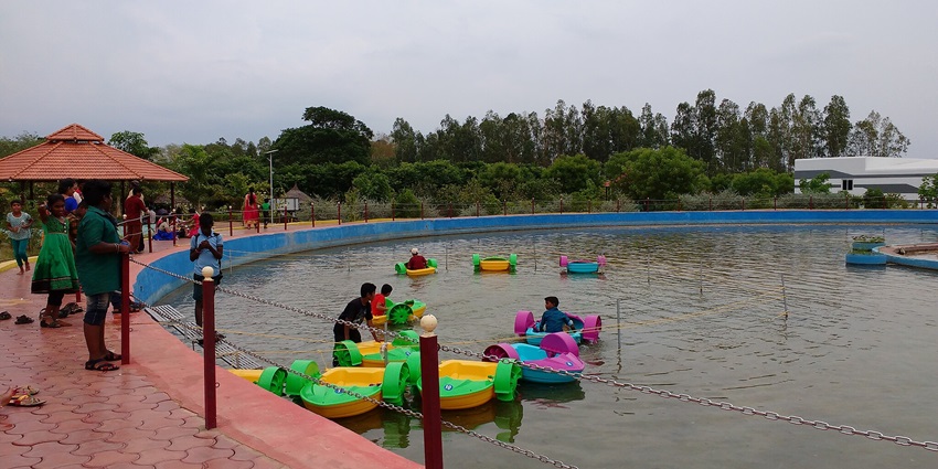 An image showing the serene pond at Srirangam Butterfly Park, one of the best places to visit in Trichy for couples.