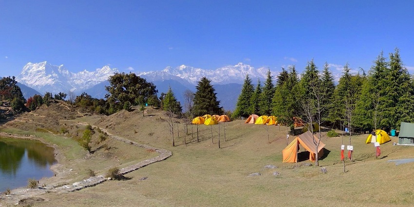 Scenic campsite offering adventure sports and tranquil river vibes.