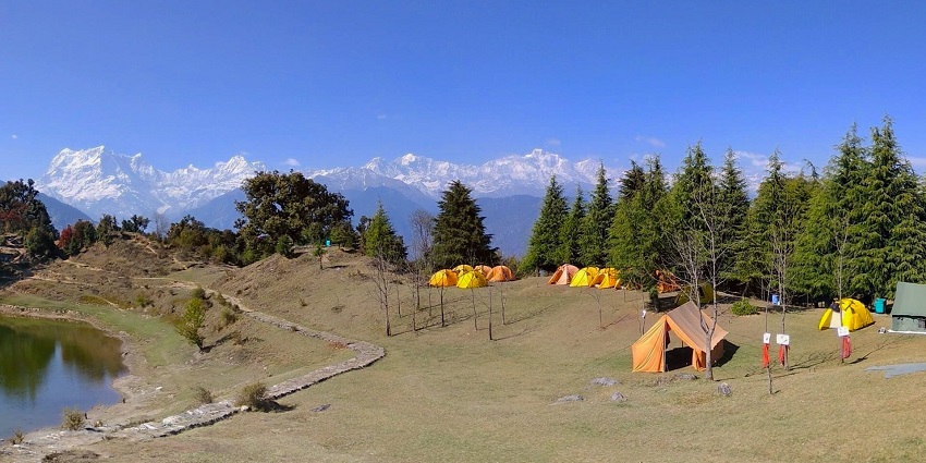 Outdoor experience enjoying nature, often involving tents and campfires.