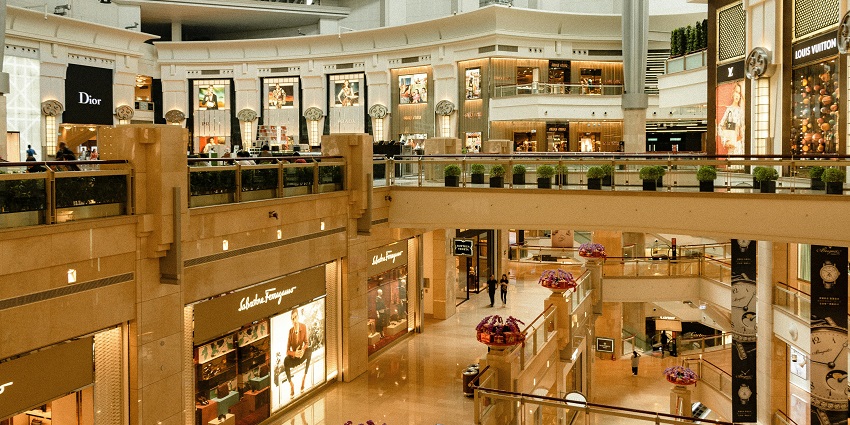 An inside view of Central Court Mall with plush setting and various branded stores.