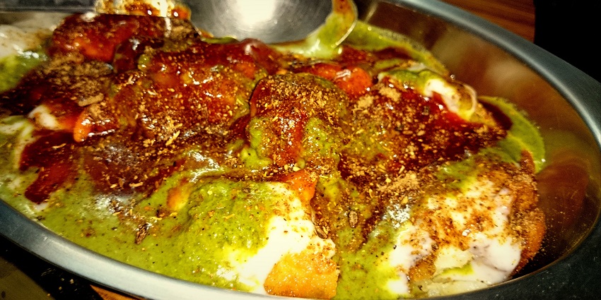 Flavorful street snack made with various ingredients and spices.
