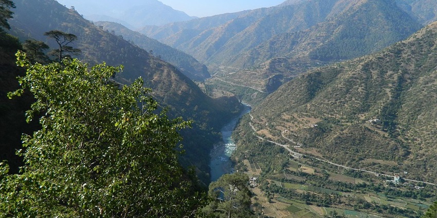 An image showing a temple in Chakrata, surrounded by beautiful mountain scenery.