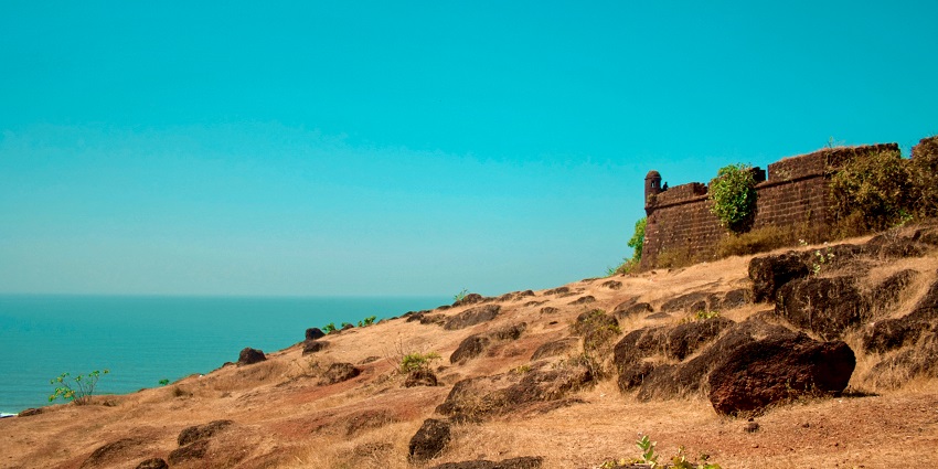 Chapora Fort, a historic site with stunning views, is a must-visit in Goa.