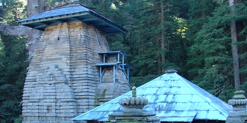 Ancient stone temples in Jageshwar complex, set amid Himalayan pine forest--places to visit in srinagar uttarakhand