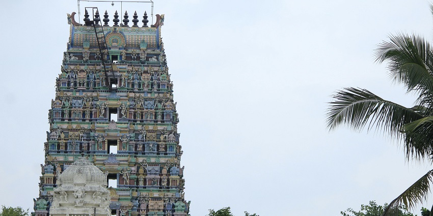 Intricately carved gopuram of the temple, offering a glimpse of the architecture