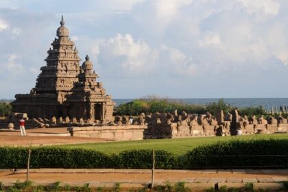 Chettipunniyam Temple with the ancient temple in the middle of a green landscape.