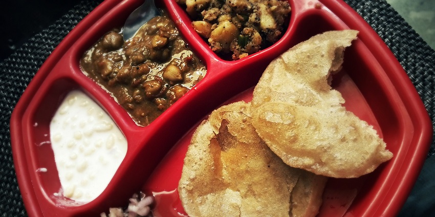 The best street food in Haridwar is the chickpeas served with fluffy, deep-fried bread.