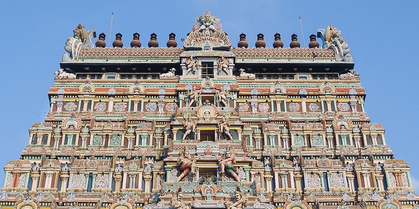 A Colourful artwork on the gopuram of the Chidambaram Nataraja Temple and a clear blue sky