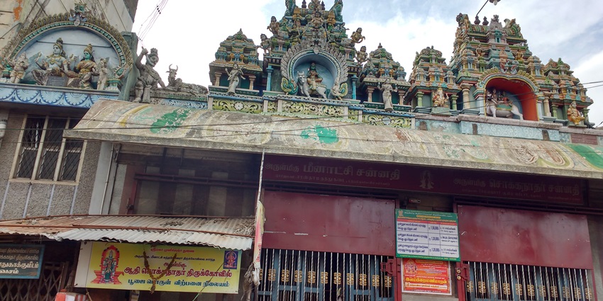 Chokkanathar Temple with intricately carved gopuram, pillars, and detailed sculptures.