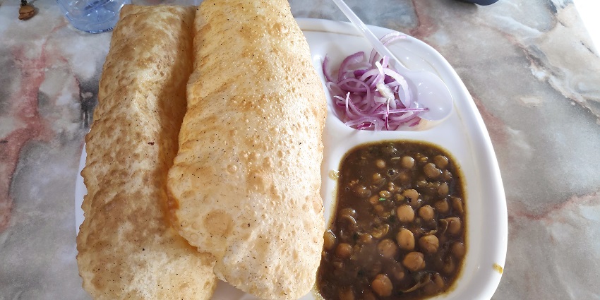 Fluffy bhature and chole make this dish a must-try among the best foods in Meerut.