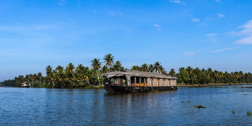 Romantic boat ride at one of the best places to visit in Pondicherry for couples with calm waters.