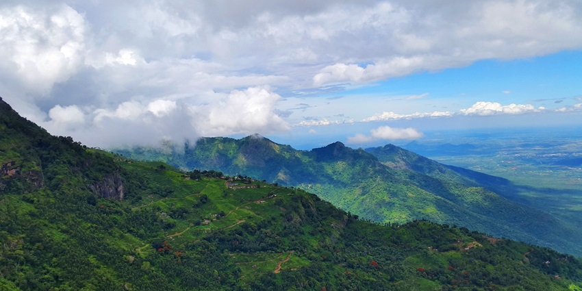 A picture of Coonoor, a tranquil hill station with tea plantations and scenic mountain views.