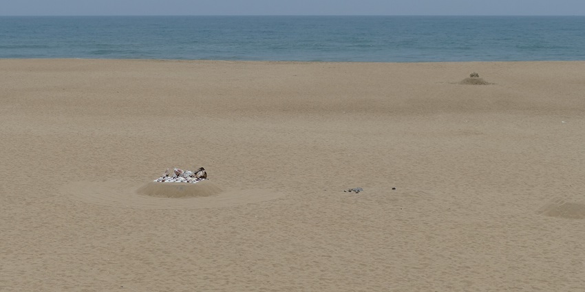 A sandy beach scene with seashells for sale a gem among beautiful beaches in Chennai.
