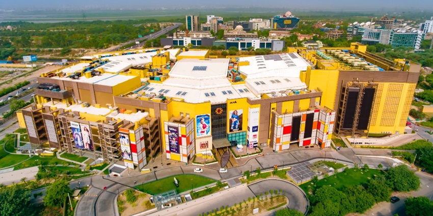 An image of a drone view of the DLF Mall of India, capturing its layout and surroundings.